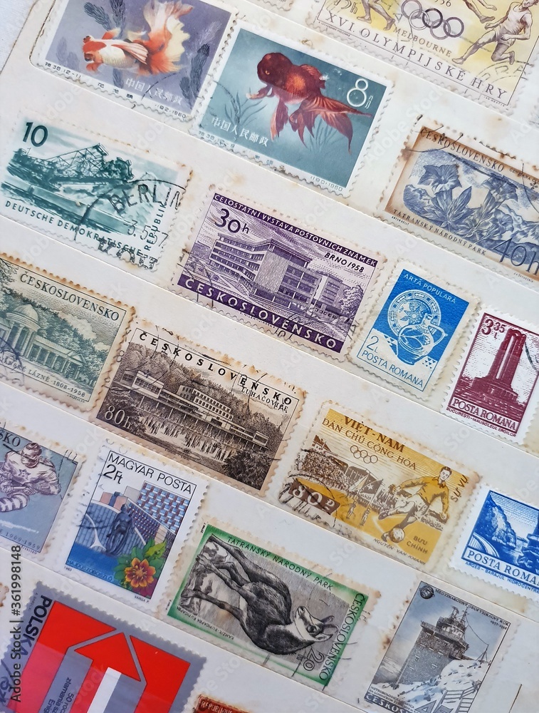 many old stamps on a philately catalog page