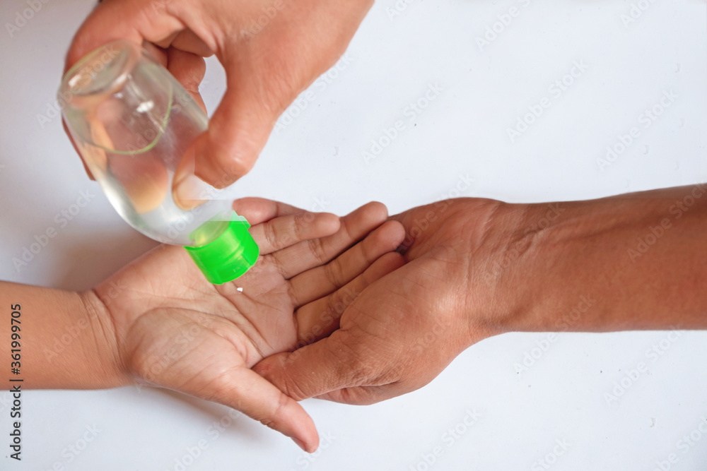 Hand getting sanitized with hand sanitizer gel Hand getting sanitized with hand sanitizer gel