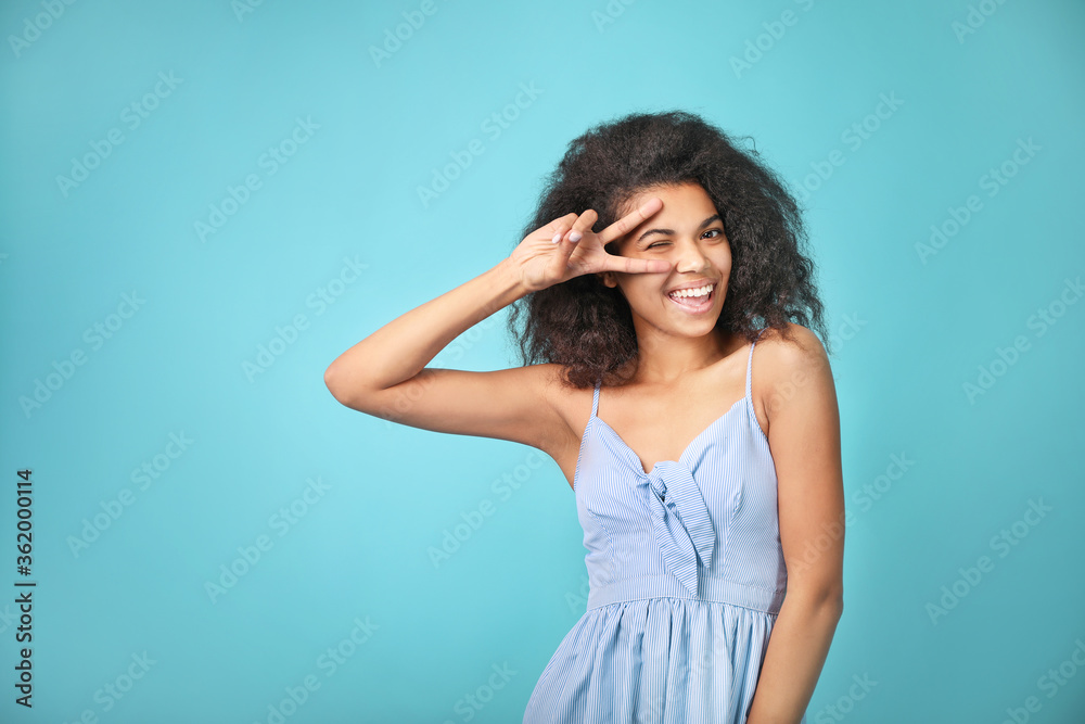 Portrait of a beautiful african woman on blue background
