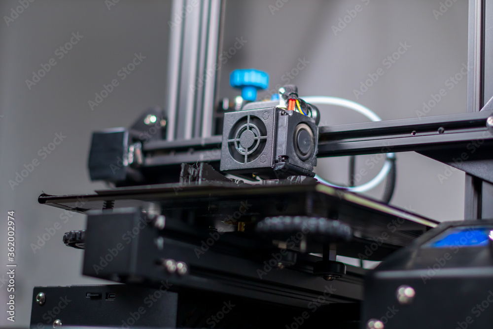 3D plastic printer during work in a factory three dimensional printing. Close-up detail. 3D plastic printer during work in a factory three dimensional printing. Close-up detail.
