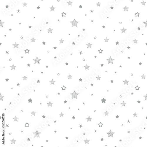 Seamless cute pattern with little different black stars, dots and circles on white background.
