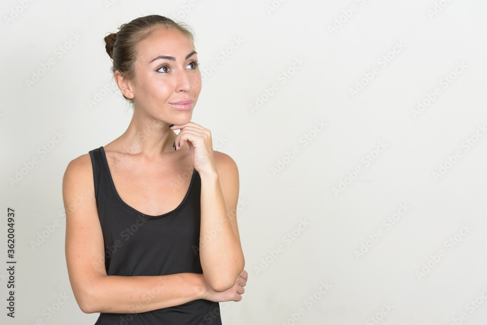 Portrait of young woman with brown hair thinking Portrait of young woman with brown hair thinking