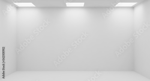 Wall of empty white room with square embedded ceiling lamps