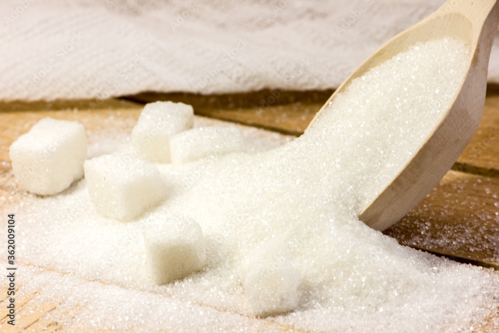 Wooden spoons and sugar. Diet. A lot of sugar. Wooden spoons and sugar. Diet. A lot of sugar.