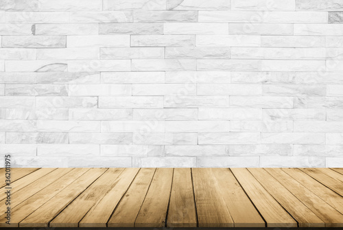 Empty wooden table top on white brick wall background  Design wood terrace white. Perspective for show space for your copy and branding. Can be used as product display montage. Vintage style concept.