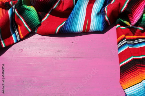 Fototapeta Naklejka Na Ścianę i Meble -  poncho Mexican cinco de mayo rug serape fiesta traditional Mexico background with stripes copy space maya blanket minimal simple -  stock, photo, photograph, image, picture 