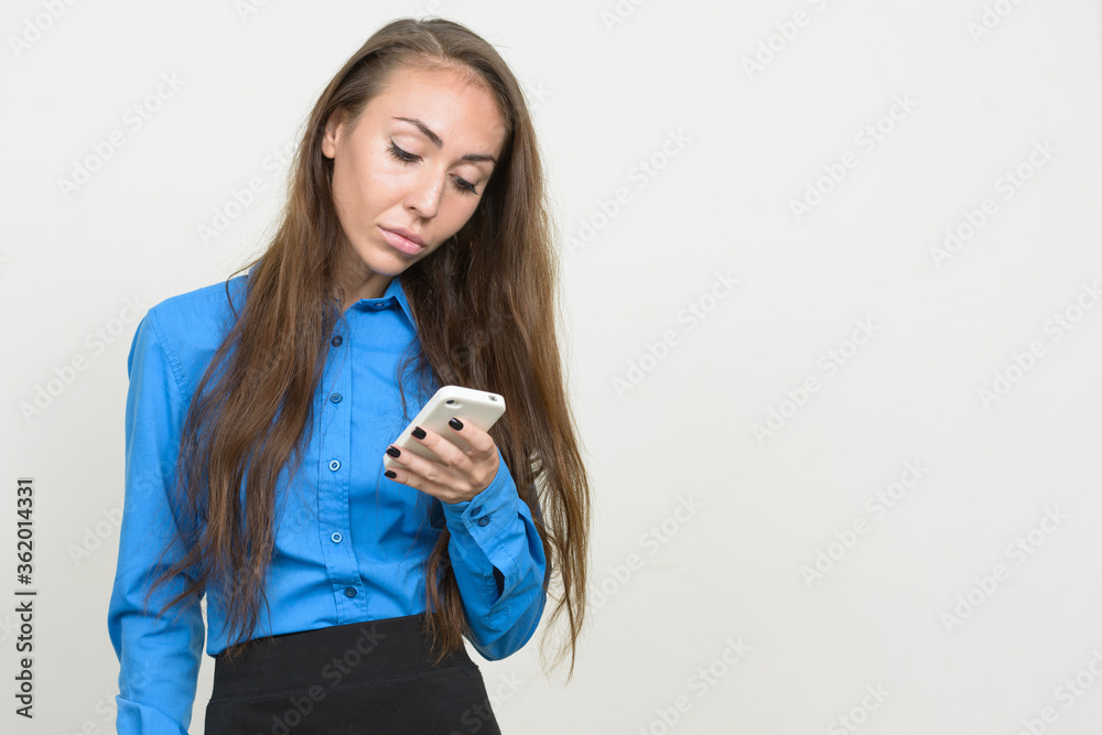 Portrait of young businesswoman with brown hair using phone Portrait of young businesswoman with brown hair using phone