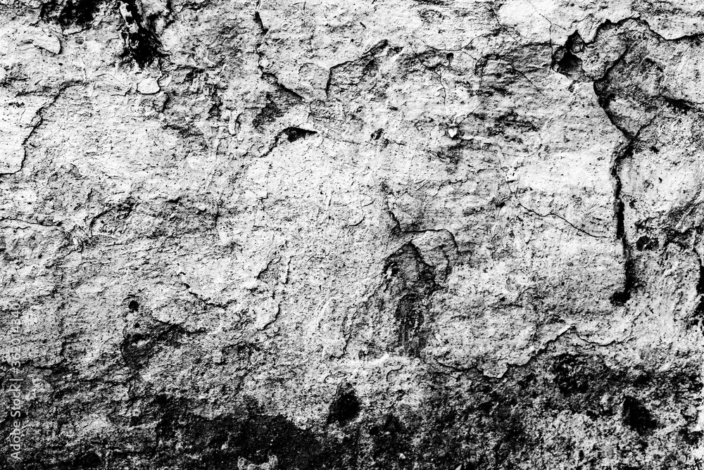 Texture of a concrete wall with cracks and scratches which can be used as a background Texture of a concrete wall with cracks and scratches which can be used as a background
