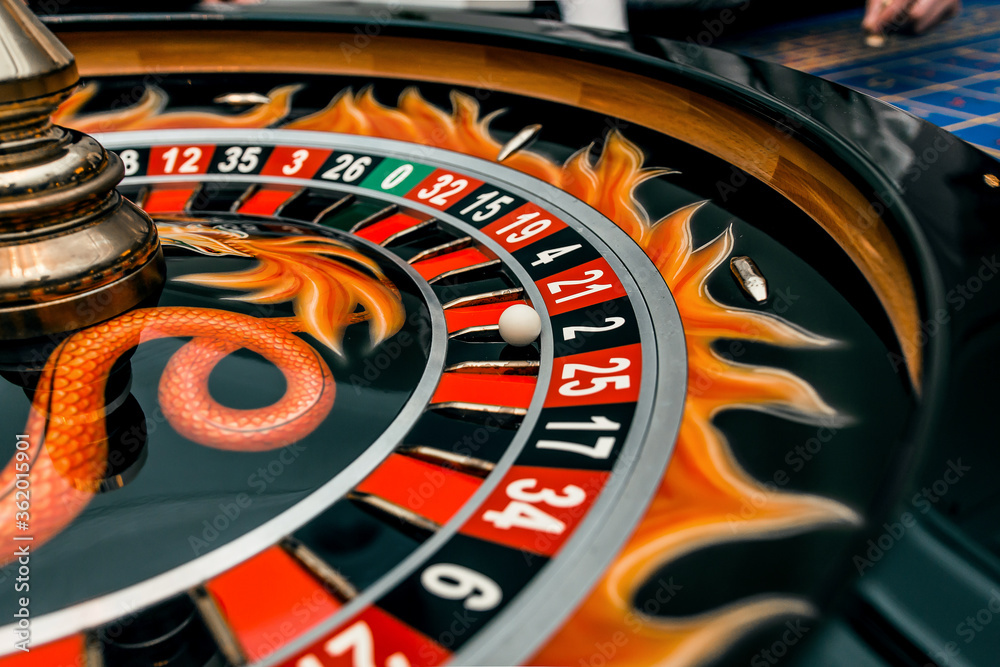 Obraz premium gambling, casino roulette, bet on black in las vegas. white ball.