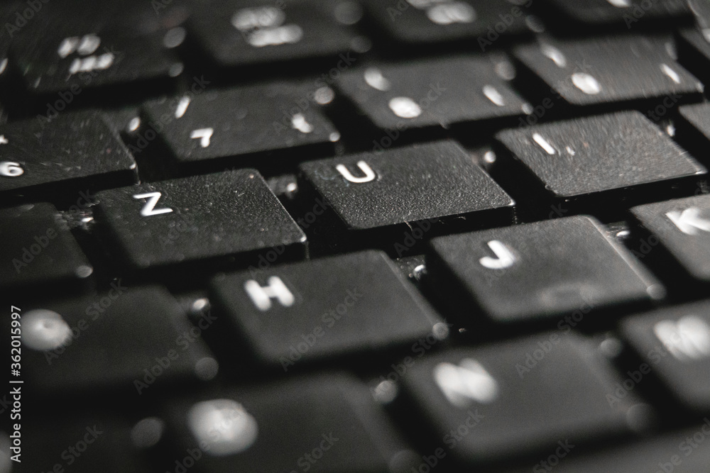 A macro shot of a black computer keyboard. A macro shot of a black computer keyboard.