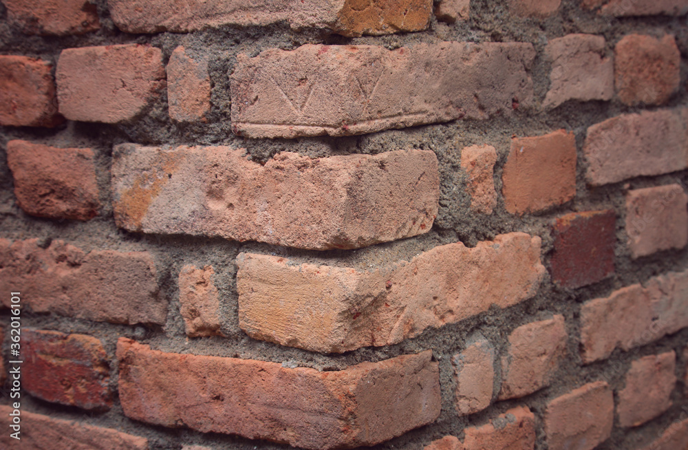 A corner of red brick wall. Two sides of building. Close up 3d perspective background. A corner of red brick wall. Two sides of building. Close up 3d perspective background.