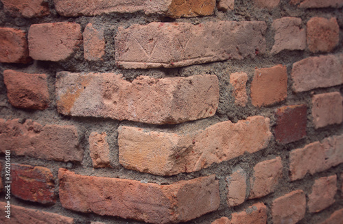 A corner of red brick wall. Two sides of building. Close up 3d perspective background.
