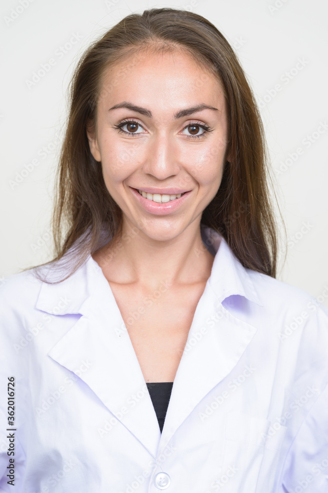 Face of happy young woman doctor with brown hair smiling Face of happy young woman doctor with brown hair smiling