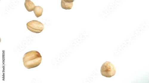 Wallpaper Mural Close-up of hazelnuts falling down and rotating on white background in slow motion Torontodigital.ca