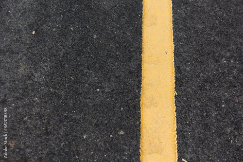 Close up road divide yellow line © anupan001