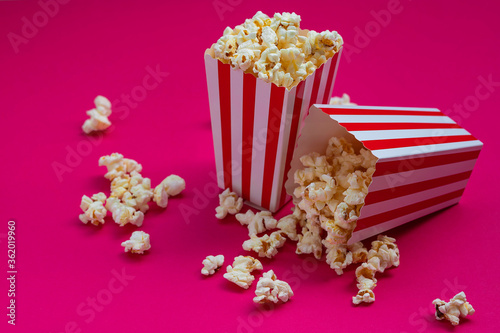 
Overhead view of some popcorn on fuchsia background
Conceptual cinema, filming, movies, feature films