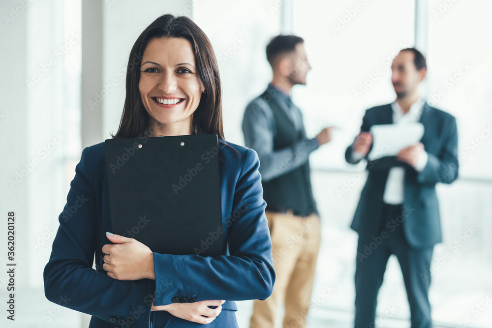 Business people analysing risks for their business in office environment. Business people analysing risks for their business in office environment.