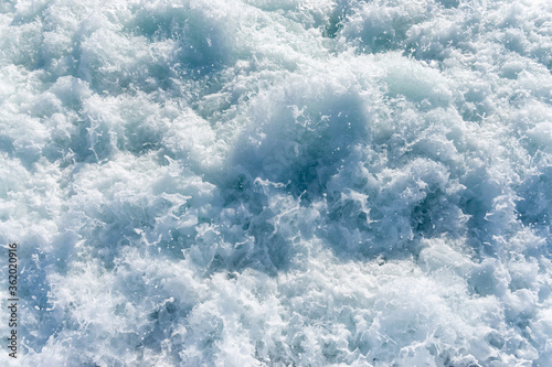 Full frame ocean foam behing the ferry photo