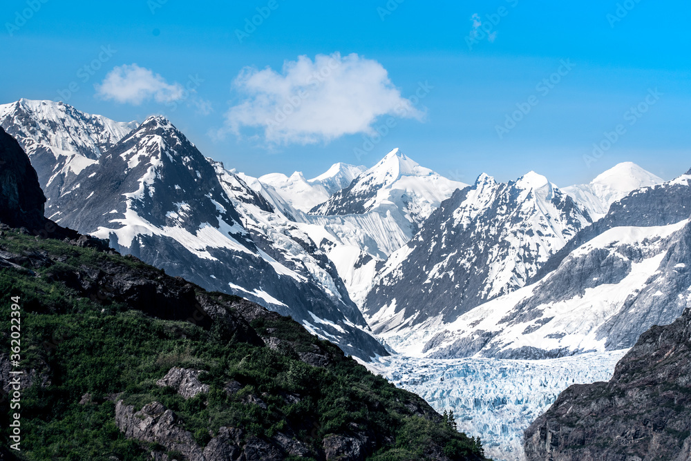 Snowy mountains of Margerie glacier, Alaska in the summer.