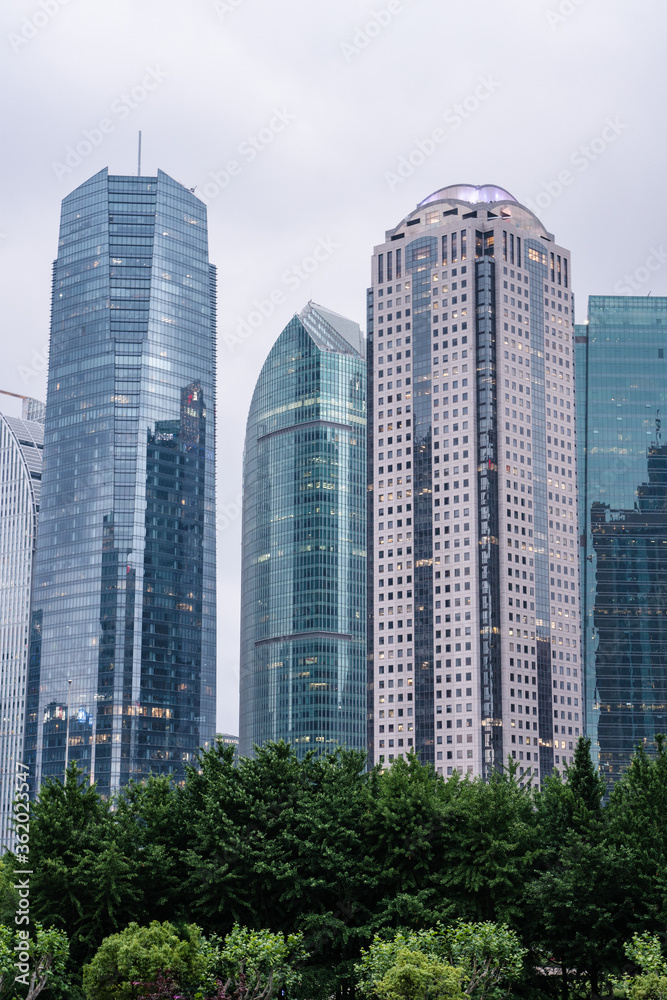 Modern skyscrapers in Lujiazui, financial district in Shanghai, China. Modern skyscrapers in Lujiazui, financial district in Shanghai, China.