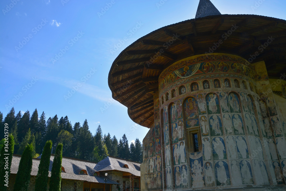 VORONET MONASTERY, BUCOVINA, ROMANIA, EUROPE, SPRING 2018. Orthodox monastery. Moldovan architectural style. Outdoor paintings, frescoes and portraits of saints with Byzantine influence