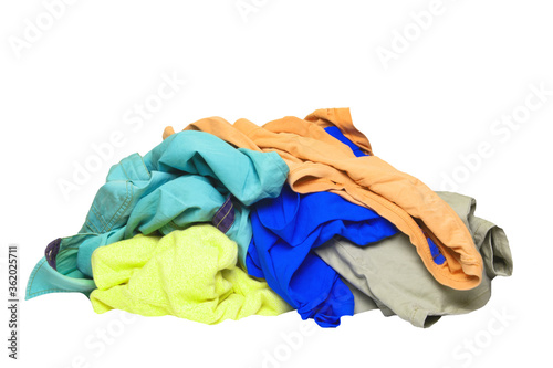 Pile of clothes isolated. Stack of colorful dirty clothes ready for the laundry isolated on a white background.
