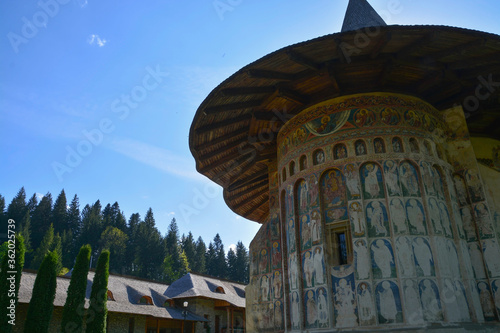 Obraz na płótnie VORONET MONASTERY, BUCOVINA, ROMANIA, EUROPE, SPRING 2018. Orthodox monastery. Moldovan architectural style. Outdoor paintings, frescoes and portraits of saints with Byzantine influence w salonie