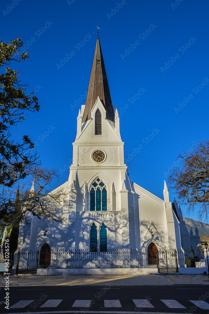 Obraz premium Church Moederkerk (means Mother Church) - Dutch Reformed church in Stellenbosch. This impressive building with a Neo Gothic Tower completed in 1863. Stellenbosch - town in 50 km east of Cape Town.
