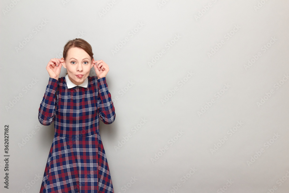 Portrait of happy cheerful cute girl making funny face Portrait of happy cheerful cute girl making funny face