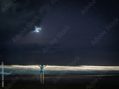 a contemplating man with nice evening sky over the beach with bright Venus