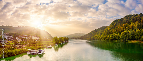 Autumn landscape with river, sunrise at the Moselle at Bullay photo