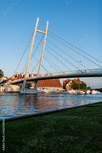 Fototapeta Naklejka Na Ścianę i Meble -  Pedestrian Bridge in Mikolajki. Mikolajki, Warmian-Masurian, Poland - aerial view