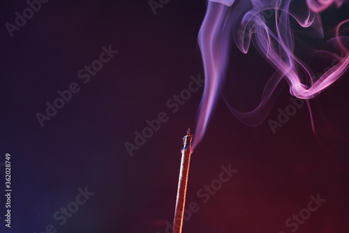 Multi colored smoke from an incense stick
