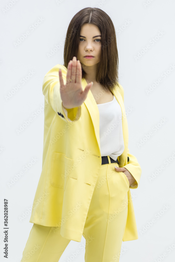 Business woman disapproving with NO hand sign gesture over white background. Business woman disapproving with NO hand sign gesture over white background.