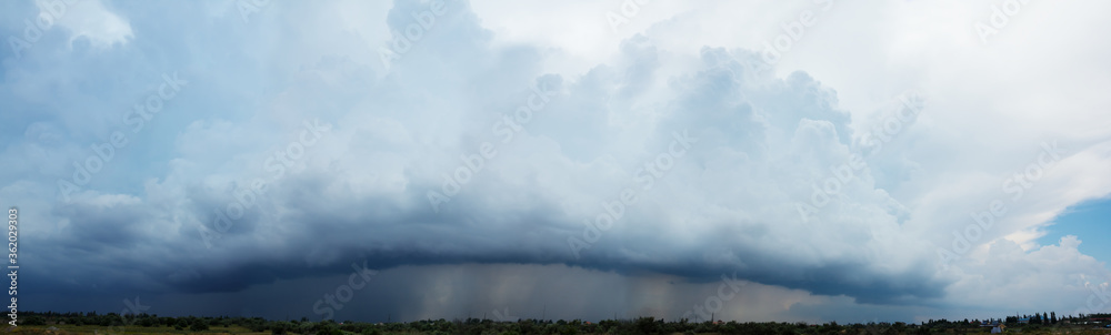 dramatic dense rainy clouds in a sky, cyclone panoramic background