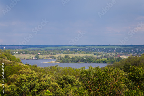 view from a forest to a lake, outdoor countryside scene
