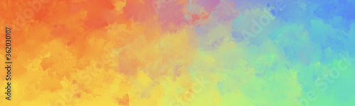 Colorful watercolor background of abstract bright rainbow colors of green blue yellow and purple