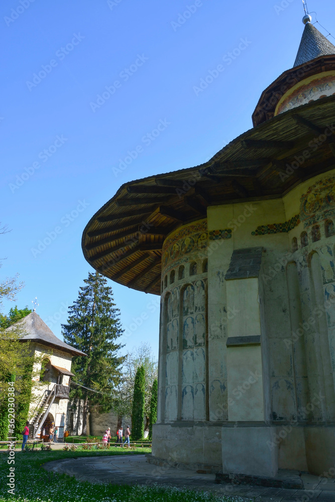 VORONET MONASTERY, BUCOVINA, ROMANIA, EUROPE, SPRING 2018. Orthodox monastery. Moldovan architectural style. Outdoor paintings, frescoes and portraits of saints with Byzantine influence.