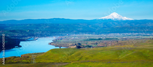 The rolling hills of Columbia Hills State Park, Washington, the Columbia River, City of The Dalles, Oregon and Mt Hood in backgrould.