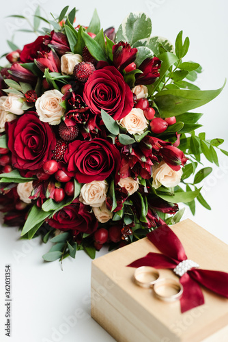 the bride s bouquet  bouquet of red roses  wedding rings  bridal bouquet with rings