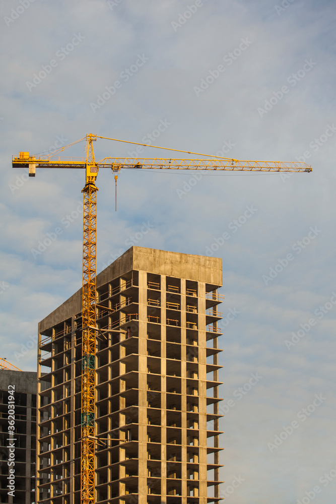 Construction site with cranes against the cloudy sky
Construction site with cranes against the cloudy sky