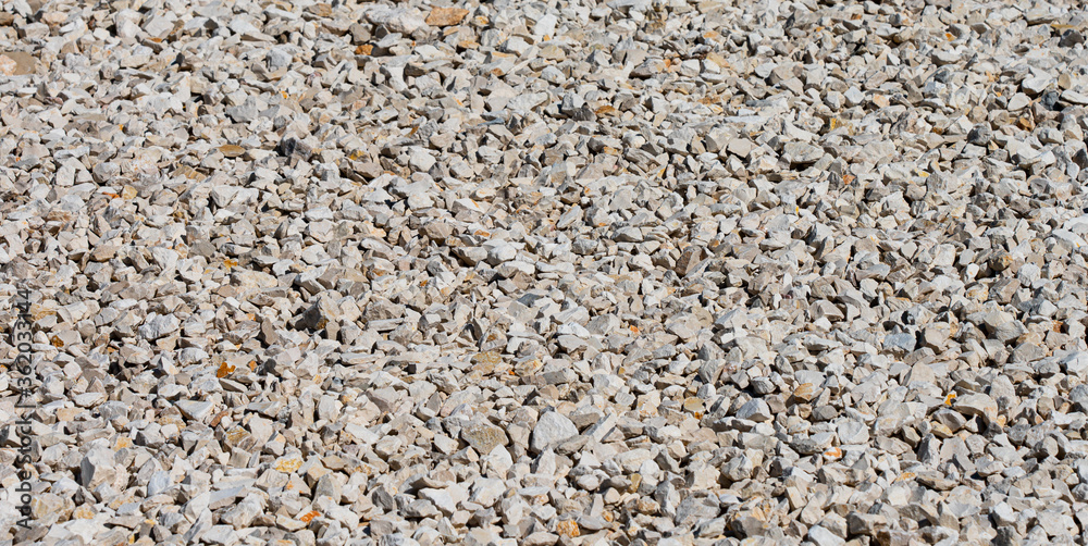 Crushed stone on a building site. Building material for road construction and paths Crushed stone on a building site. Building material for road construction and paths