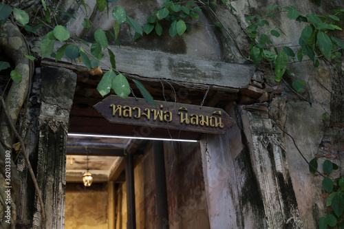 Amphawa,Thailand-JUNE 20,2020:The sign in side chuch at Bang kung temple root of Bodhi tree.