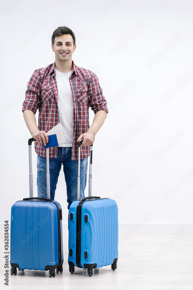 Male passenger lining up at check-in counter at the modern international airport. Male passenger lining up at check-in counter at the modern international airport.