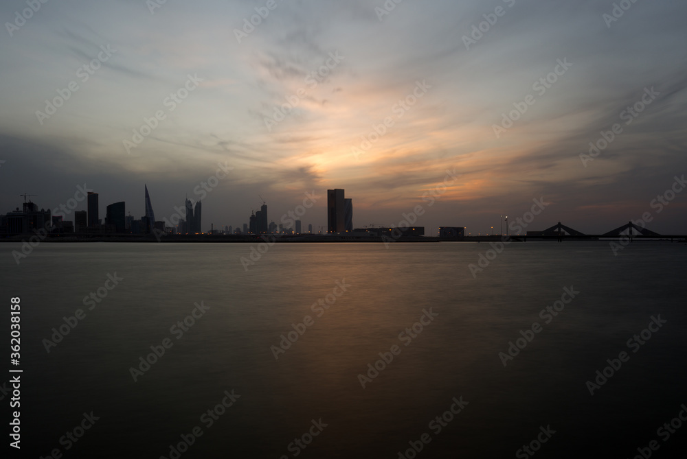 Bahrain skyline at dusk with dramatic cloud