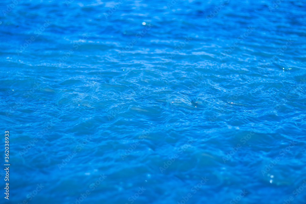 Bubbling blue water on a sunny day.