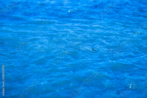 Bubbling blue water on a sunny day.