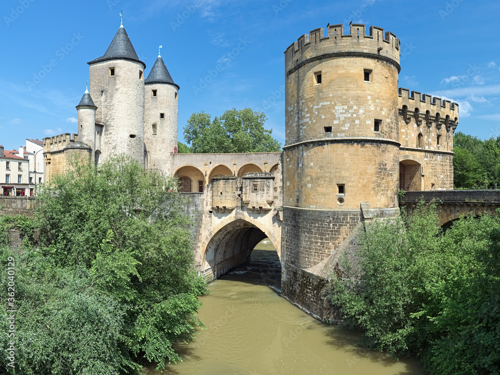 Germans' Gate (Porte des Allemands) in Metz, France. This is the medieval fortified bridge across the Seille river with two round towers of the 13th century and two gun bastions of the 15th century.