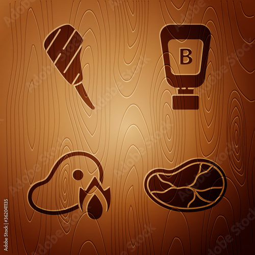 Set Steak meat, Rib eye steak, Grilled steak meat and fire flame and Sauce bottle on wooden background. Vector