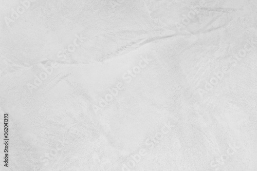 Neutral white colored low contrast Concrete textured background with roughness and irregularities to your concept or product